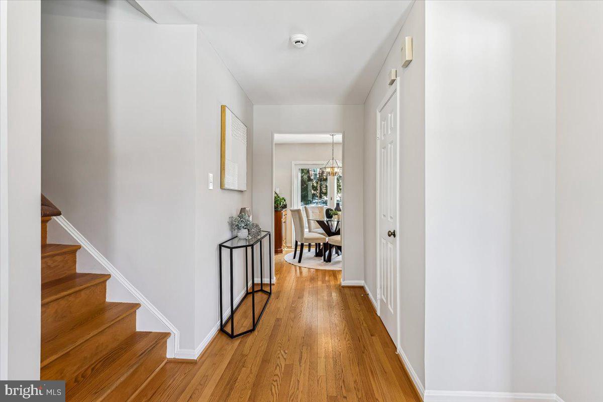 3105 Miller Heights Road Oakton, VA 22124 - Photo 24 of 60 a view of a hallway with wooden floor and staircase