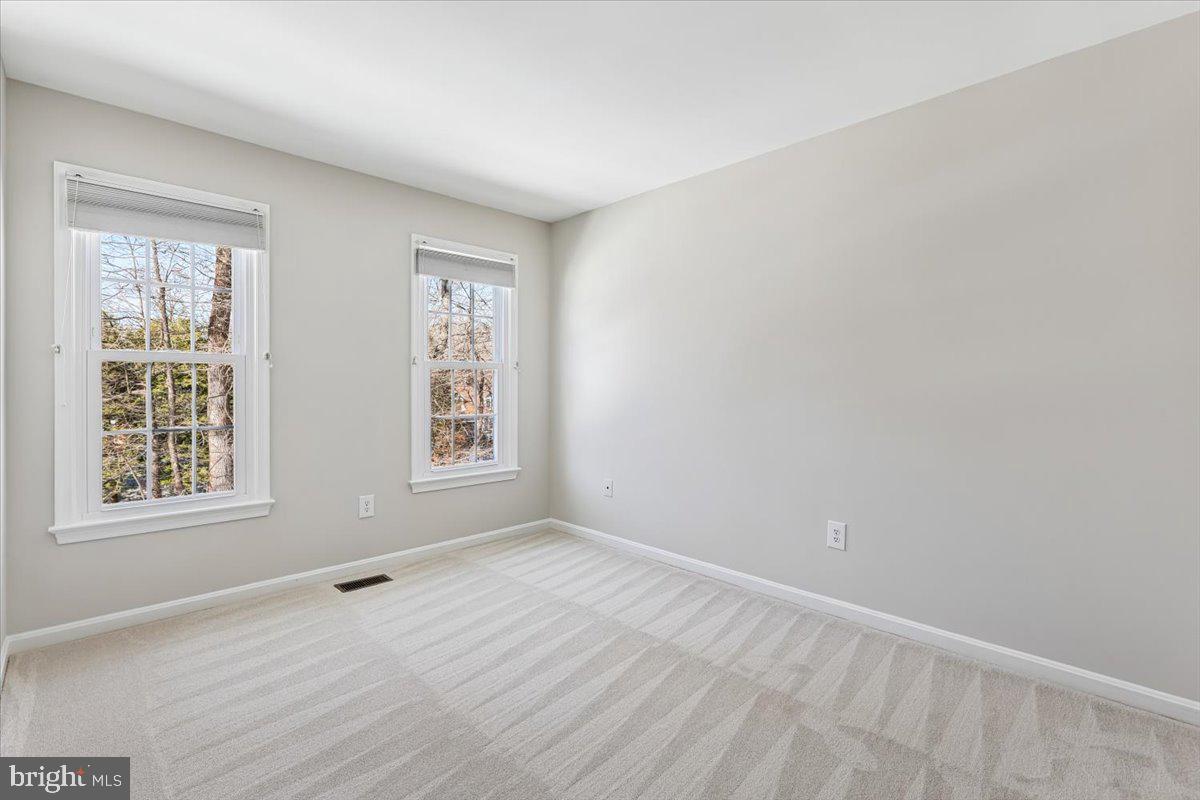 3105 Miller Heights Road Oakton, VA 22124 - Photo 37 of 60 a view of an empty room with wooden floor and a window