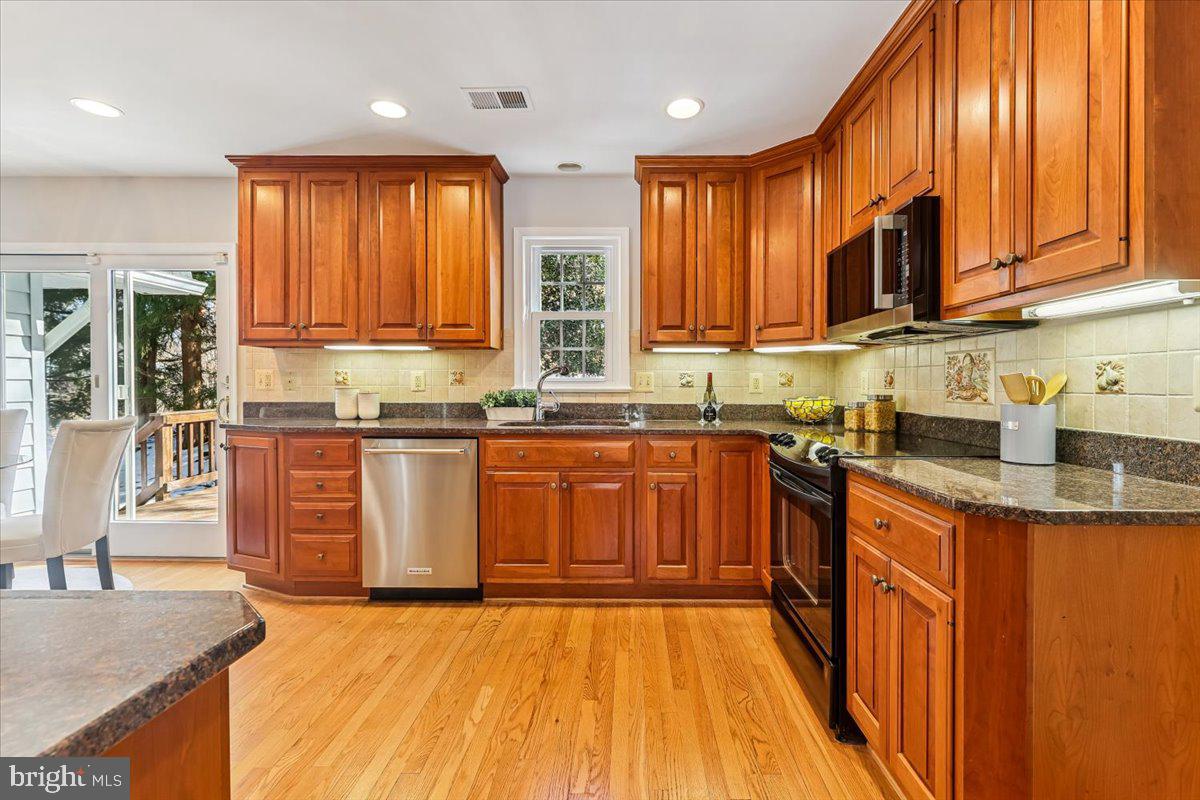 3105 Miller Heights Road Oakton, VA 22124 - Photo 4 of 60 Updated kitchen with cherry wood cabinets.