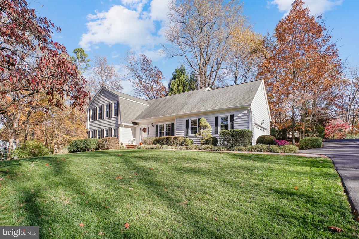 3105 Miller Heights Road Oakton, VA 22124 - Photo 50 of 60 a view of a house with a big yard and large trees