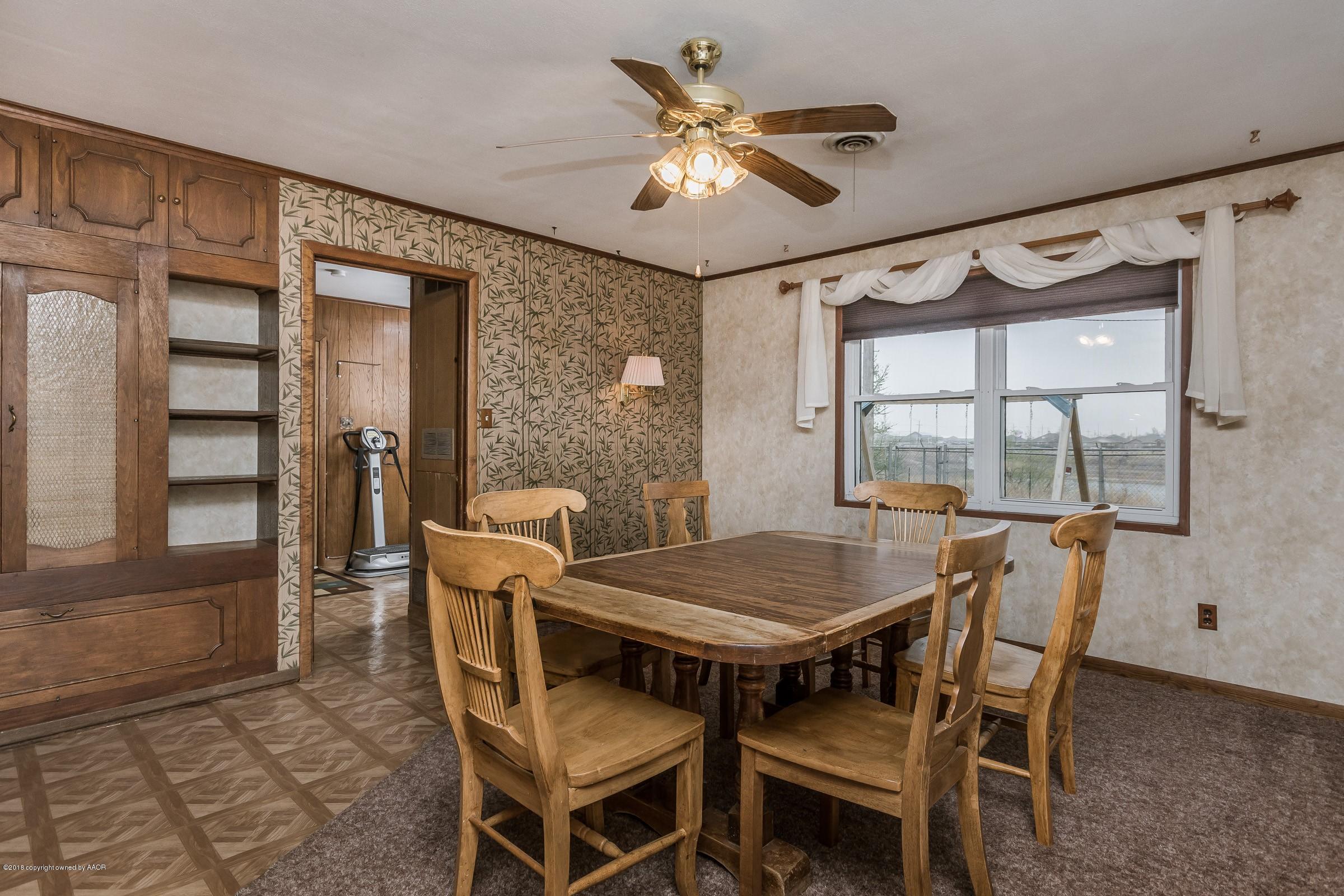 1201 Southwest 48th Avenue Amarillo, TX 79110 - Photo 7 of 18 a view of a dining room with furniture window and outside view
