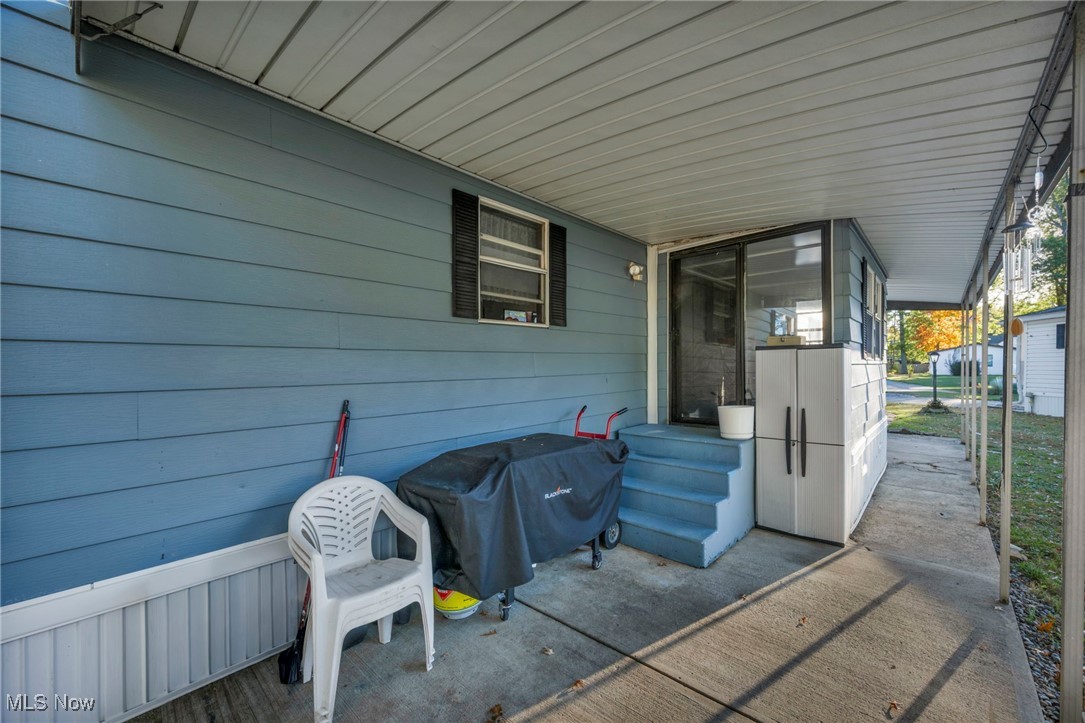 35157 Center Ridge Road, Unit 126 North Ridgeville, OH 44039 - Photo 7 of 50 Covered porch with a grill