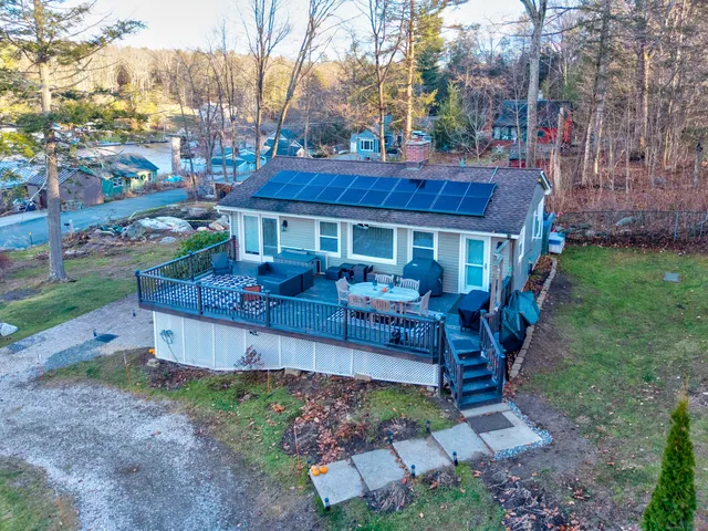a view of a house with a yard porch and sitting area
