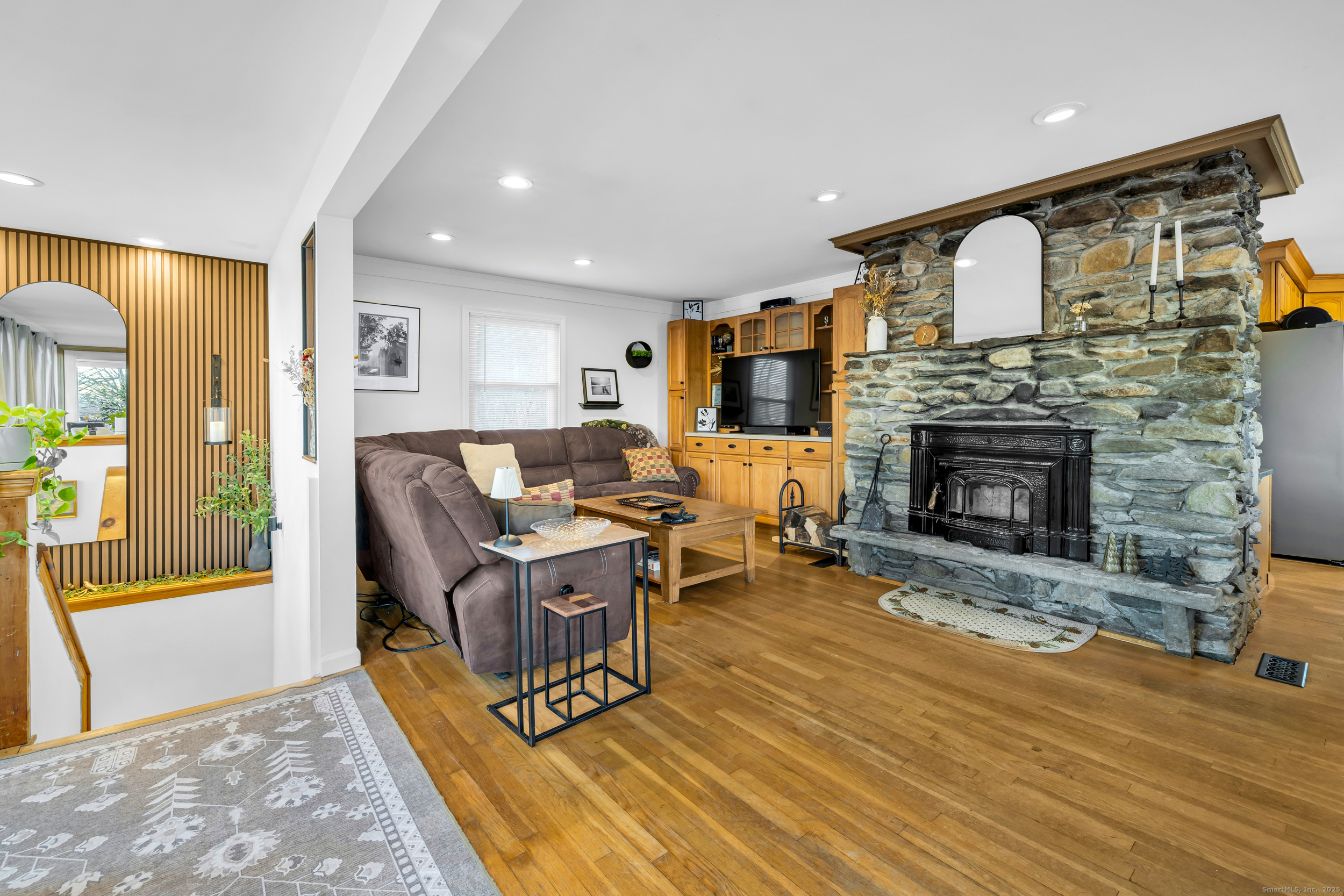 25 Cottage Grove Road Goshen, CT 06756 - Photo 12 of 38 a living room with furniture and a fireplace