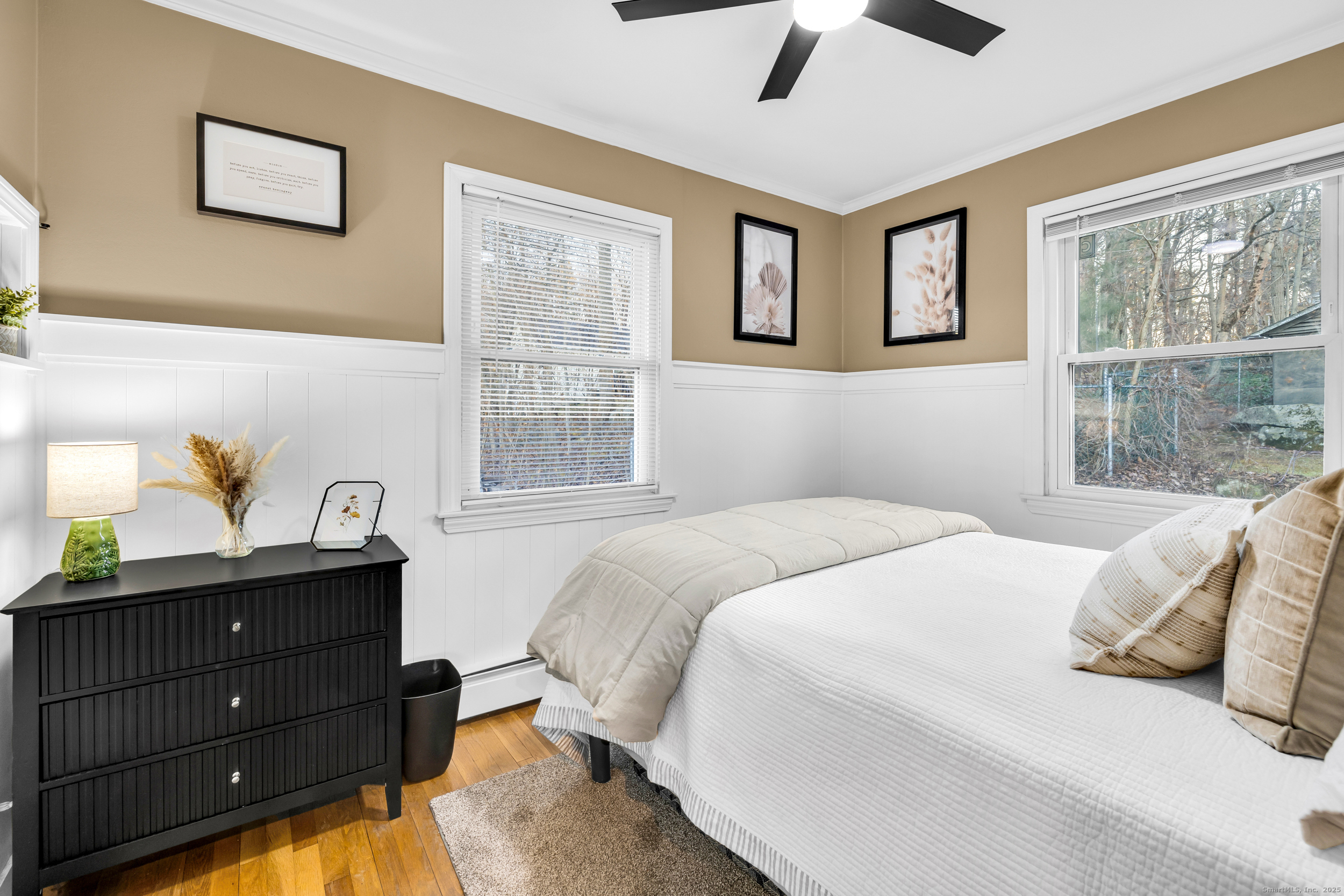 25 Cottage Grove Road Goshen, CT 06756 - Photo 20 of 38 a bedroom with a bed and windows