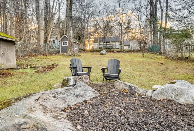 a swimming pool view with a outdoor seating