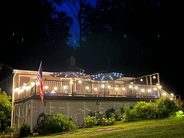 a view of a house with pool and garden