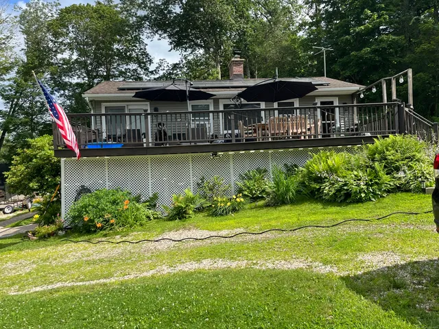a picture of a room with a floor and a white wall