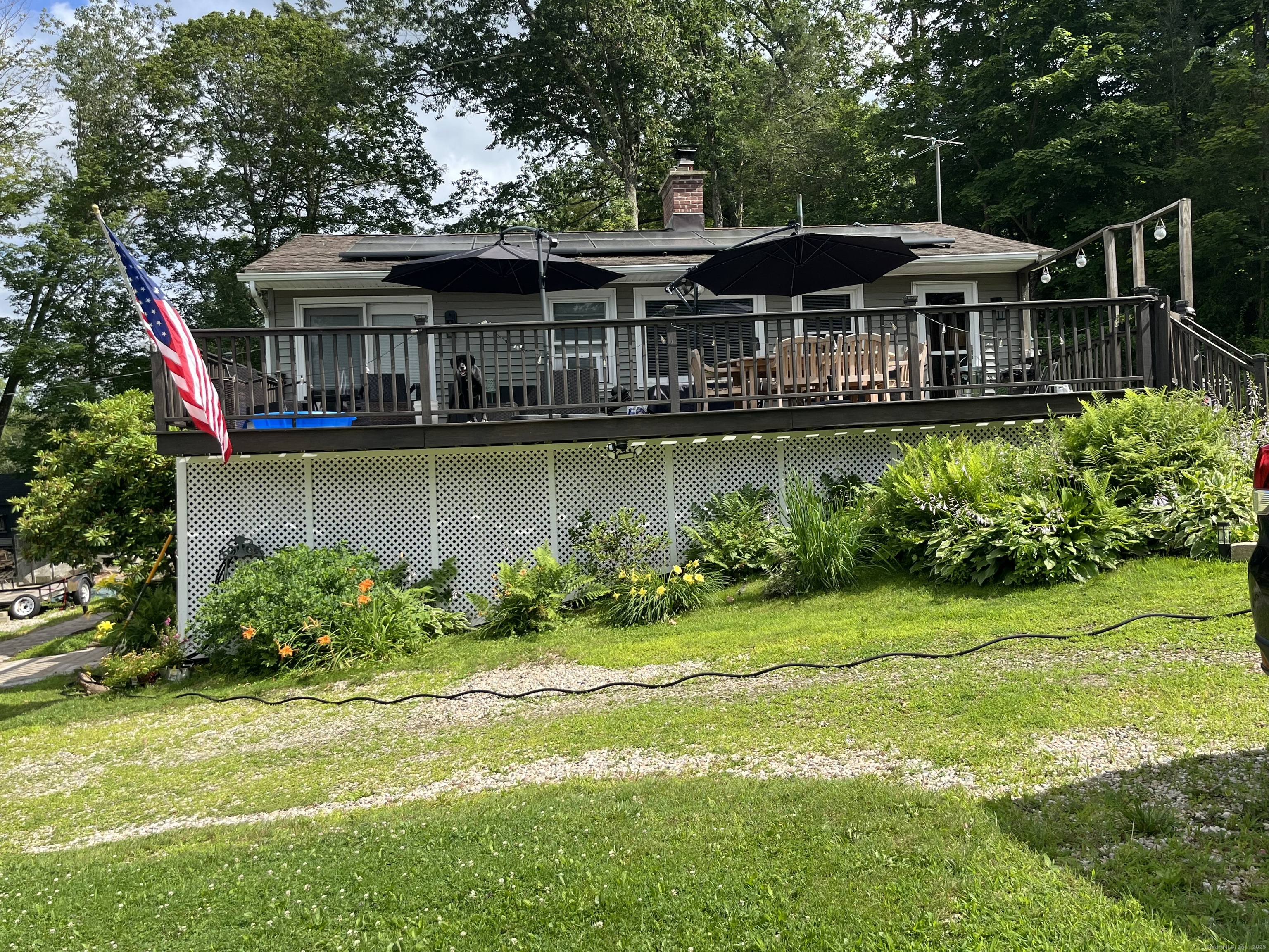 25 Cottage Grove Road Goshen, CT 06756 - Photo 34 of 38 a front view of a house with garden