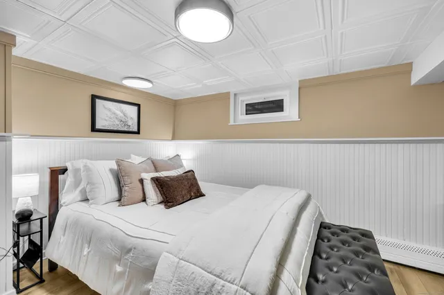 a bedroom with bed and a window