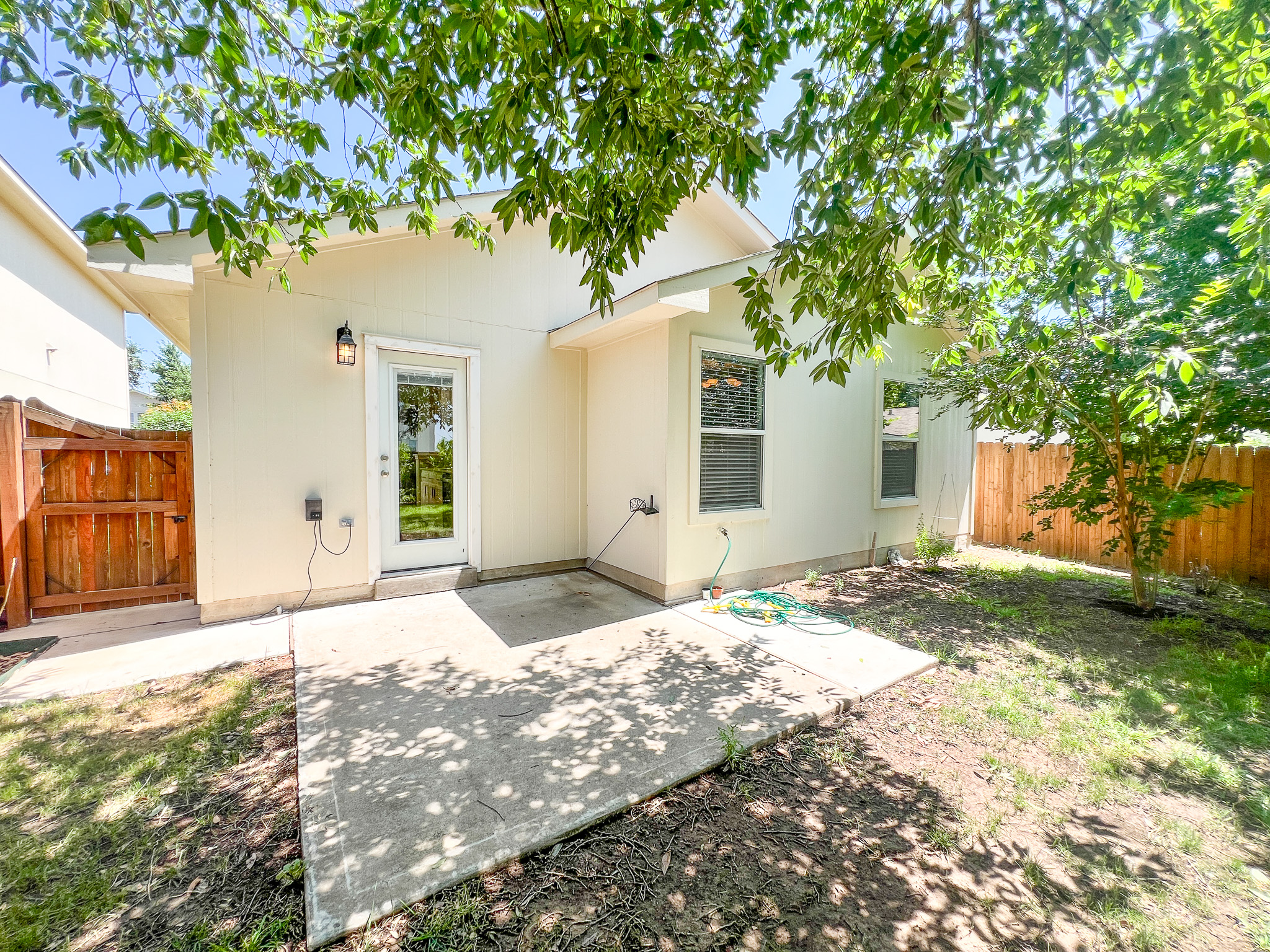 298 Jack Rabbit Lane Buda, TX 78610 - Photo 18 of 24 A private, fenced backyard offers a concrete patio, ideal for outdoor enjoyment.