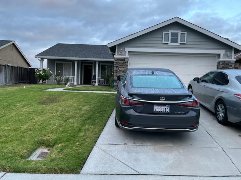 a car parked in front of a house