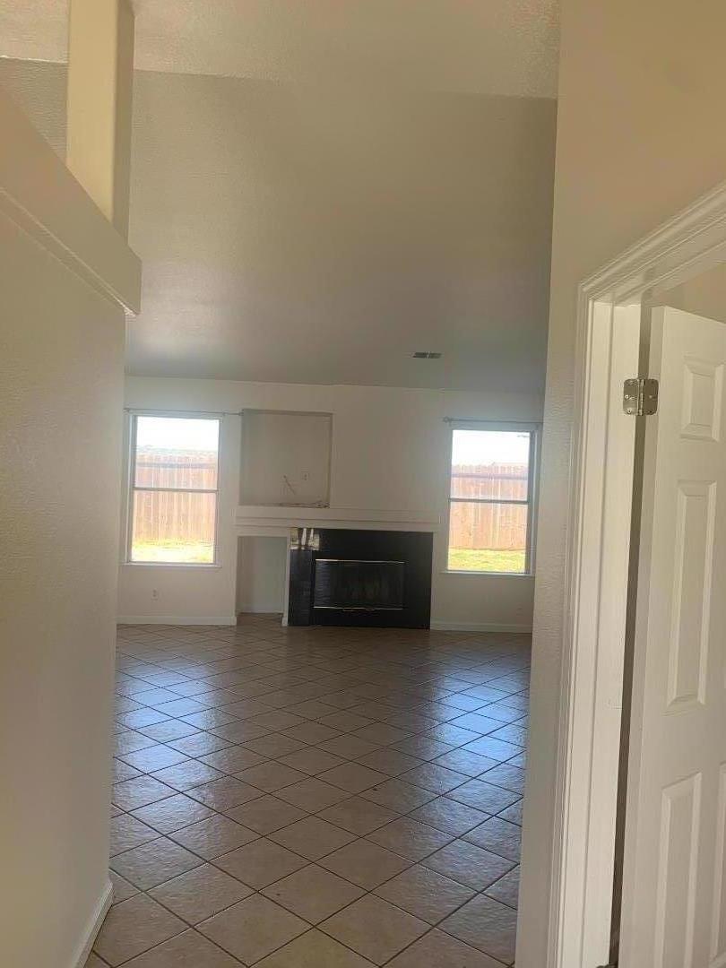 2396 Glenview Drive Hollister, CA 95023 - Photo 8 of 13 a view of empty room with wooden floor and window