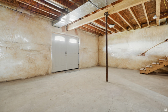 20 Q Puma Road Fairview, UT 84629 - Photo 22 of 27 Concrete floor basement with exposed wood joists and a double door exterior access
