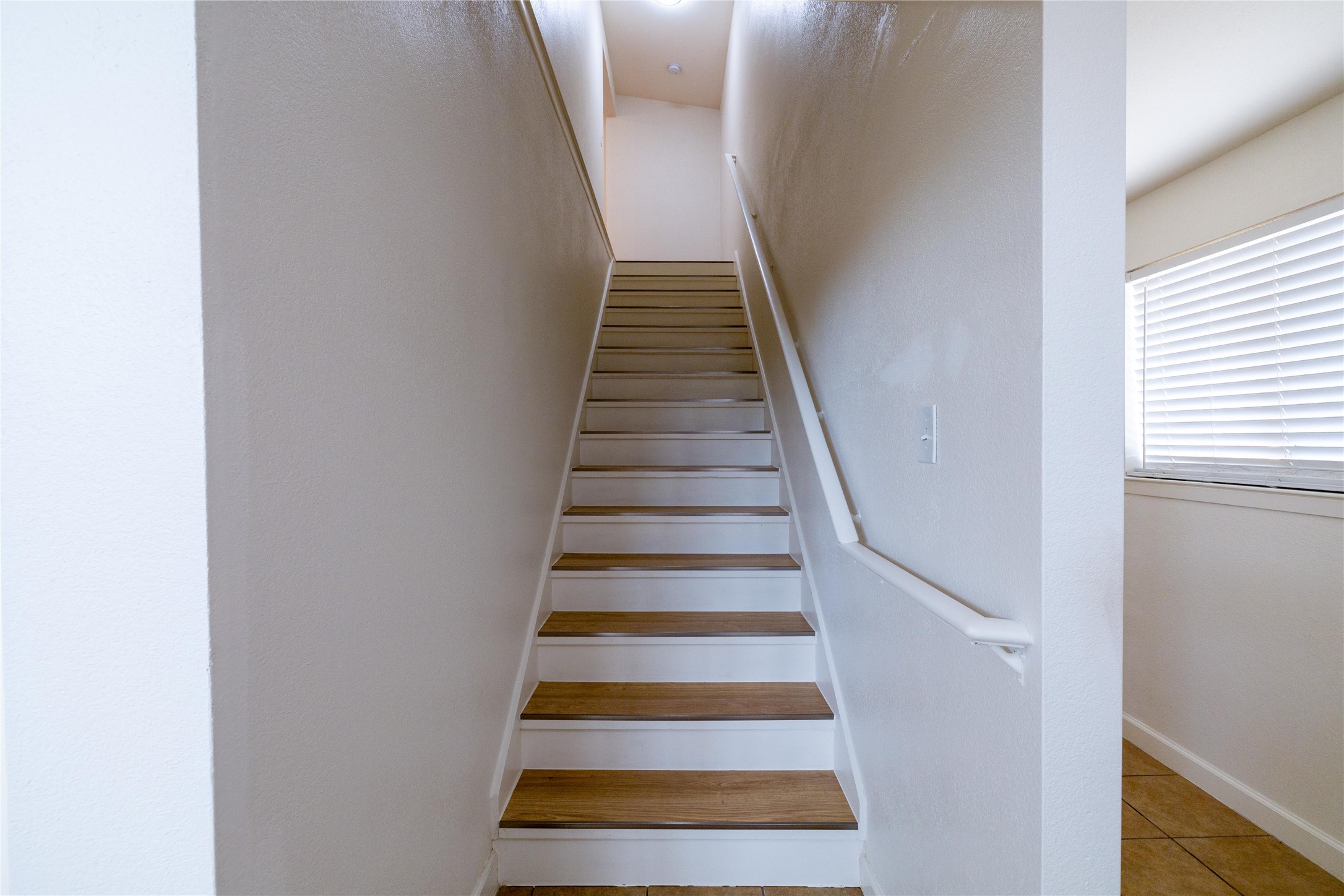 4304 Scottsdale Road Austin, TX 78721 - Photo 12 of 18 Stairway with tile patterned flooring