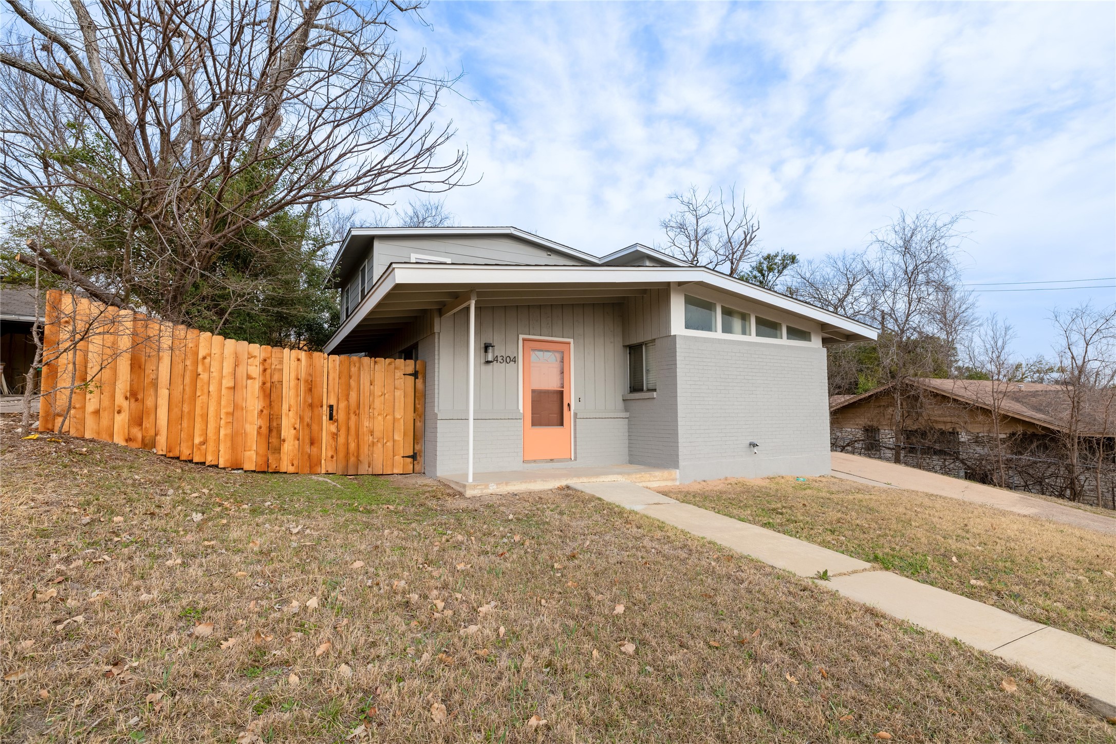 4304 Scottsdale Road Austin, TX 78721 - Photo 18 of 18 View of front of house with brick siding and board and batten siding