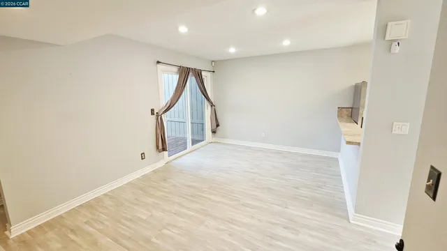 a bathroom with a sink mirror vanity and toilet