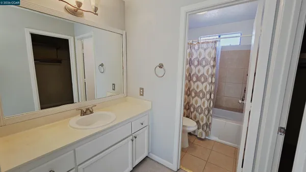 a bathroom with a sink a vanity and a shower