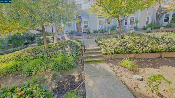 a view of a house with a yard and garage