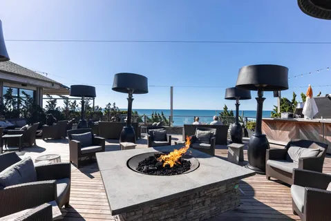 a view of a swimming pool with outdoor seating