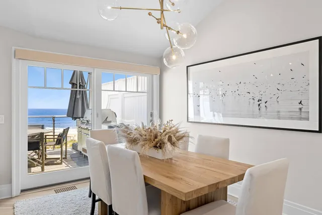 a large kitchen with a table and chairs in it