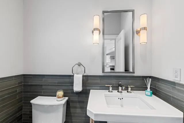 a bed room with a bed and a television