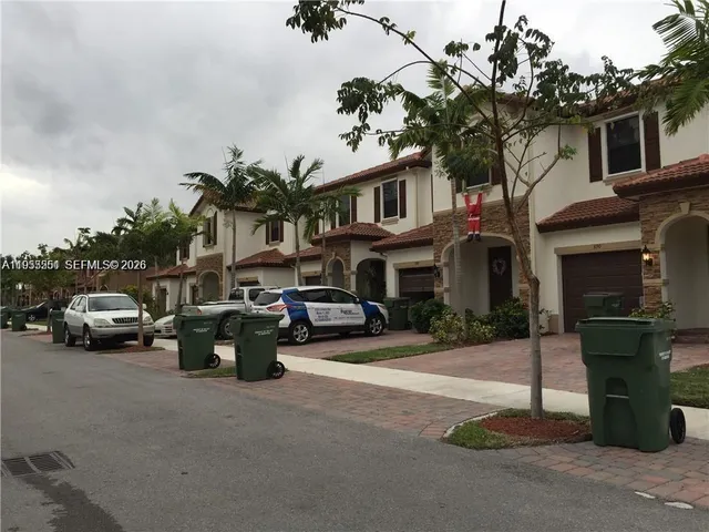 a view of a street with cars on road