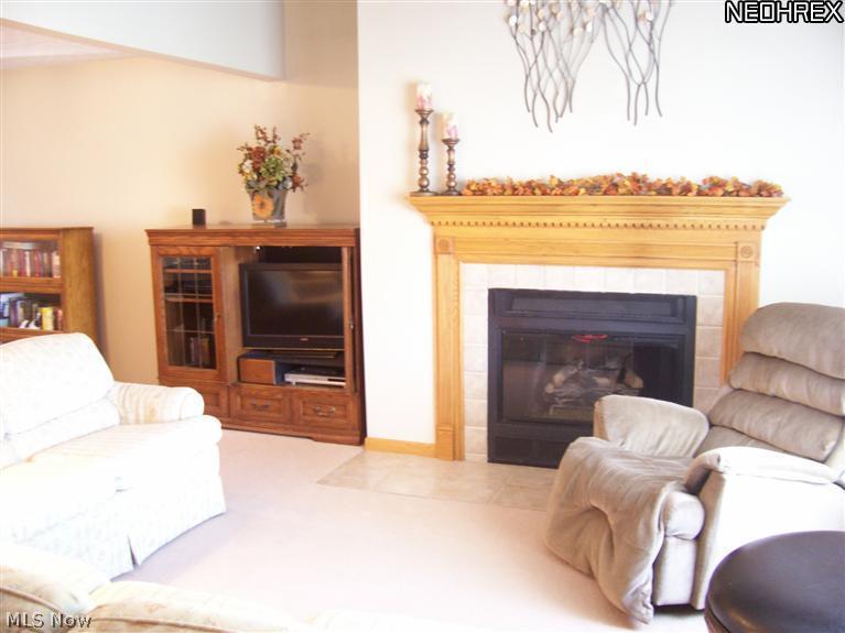 6708 Hills And Dales Road Northwest Canton, OH 44708 - Photo 8 of 18 Great room includes a fireplace!