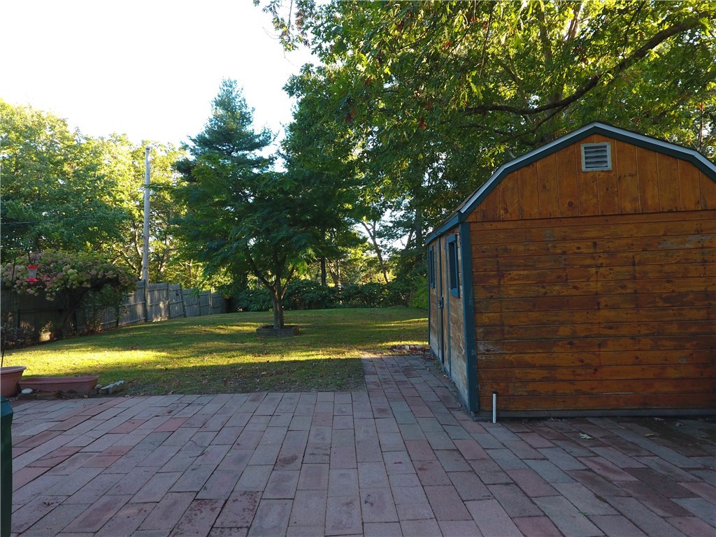 46 Overview Drive Coventry, RI 02816 - Photo 5 of 29 Large back yard with deck and patio along with a storage shed. Total lot is .37 acres
