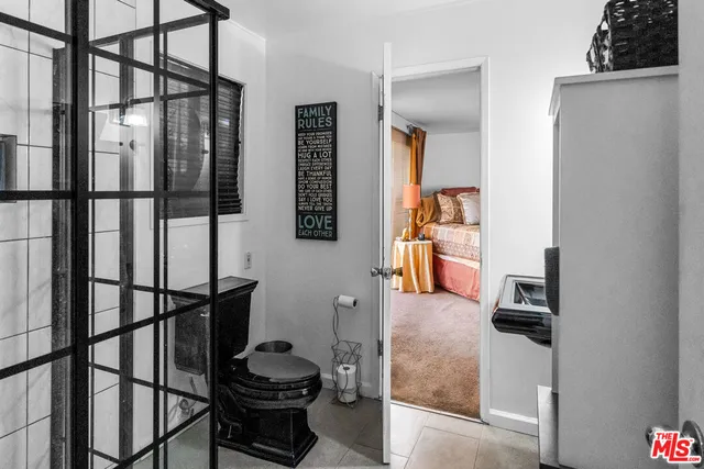 a hallway with a view of living room