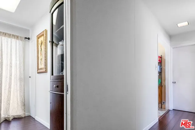 a view of hallway with wooden floor
