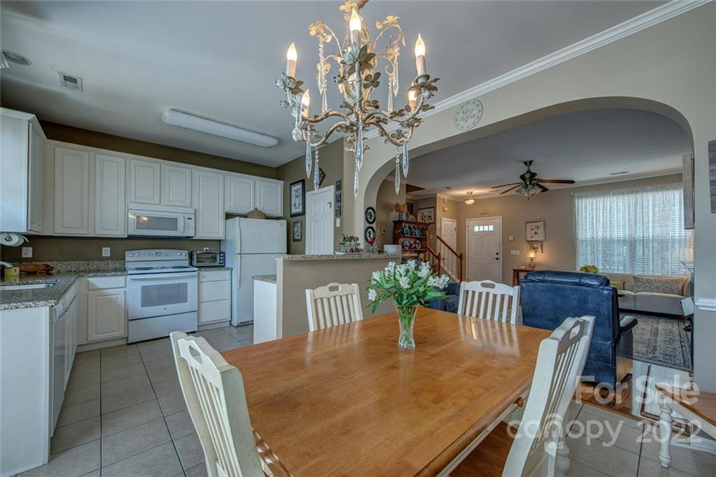 909 Azurine Circle Fort Mill, SC 29708 - Photo 16 of 30 a kitchen with cabinets table and chairs