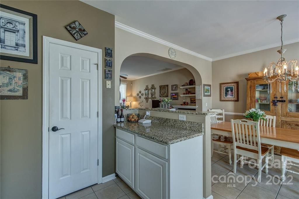909 Azurine Circle Fort Mill, SC 29708 - Photo 19 of 30 a kitchen with a table and chairs in it