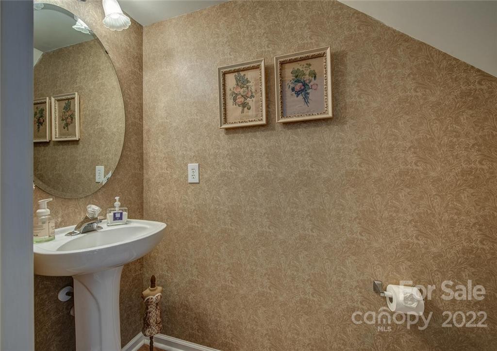 909 Azurine Circle Fort Mill, SC 29708 - Photo 21 of 30 a bathroom with a sink and a mirror