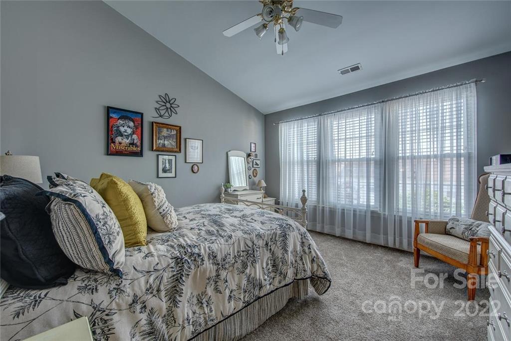 909 Azurine Circle Fort Mill, SC 29708 - Photo 23 of 30 a bedroom with a bed and a chair