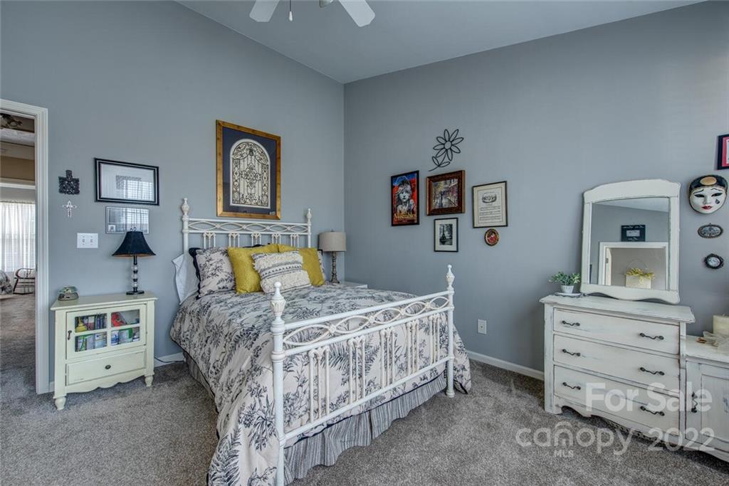 909 Azurine Circle Fort Mill, SC 29708 - Photo 24 of 30 a bedroom with a bed and wooden floor