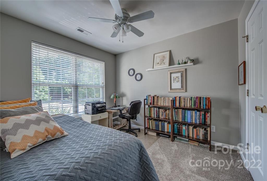 909 Azurine Circle Fort Mill, SC 29708 - Photo 26 of 30 a bedroom with a bed furniture and a window