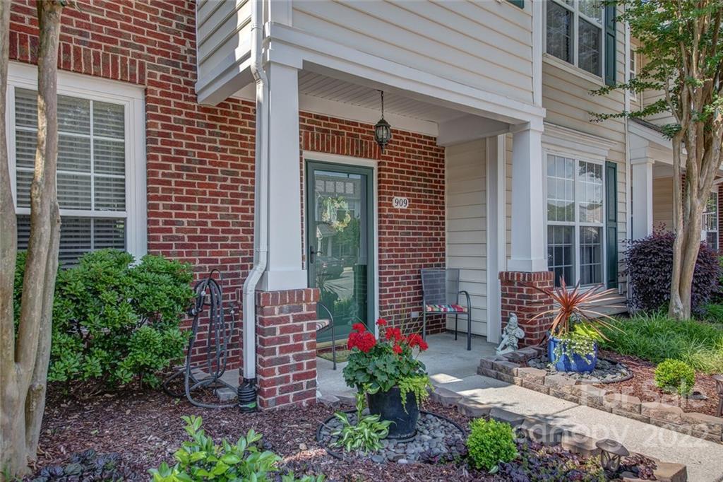 909 Azurine Circle Fort Mill, SC 29708 - Photo 4 of 30 a front view of a house with outdoor seating and plants