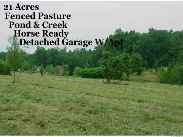 21 Acres with Fenced Pasture, Pond and Creek. Ready for Horses! Detached Garage with upstairs apt