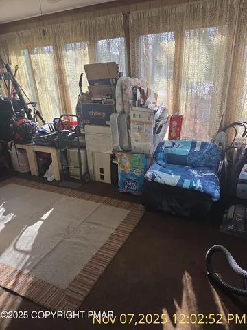 a bedroom with bed and a window