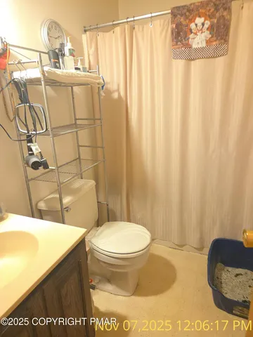 a bathroom with a toilet and a sink
