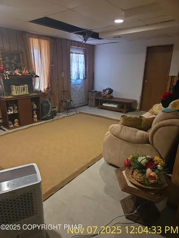 a living room with furniture and window