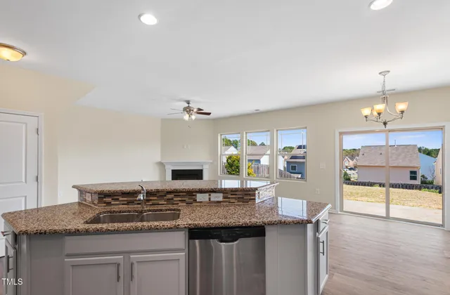 a kitchen with a sink and a refrigerator
