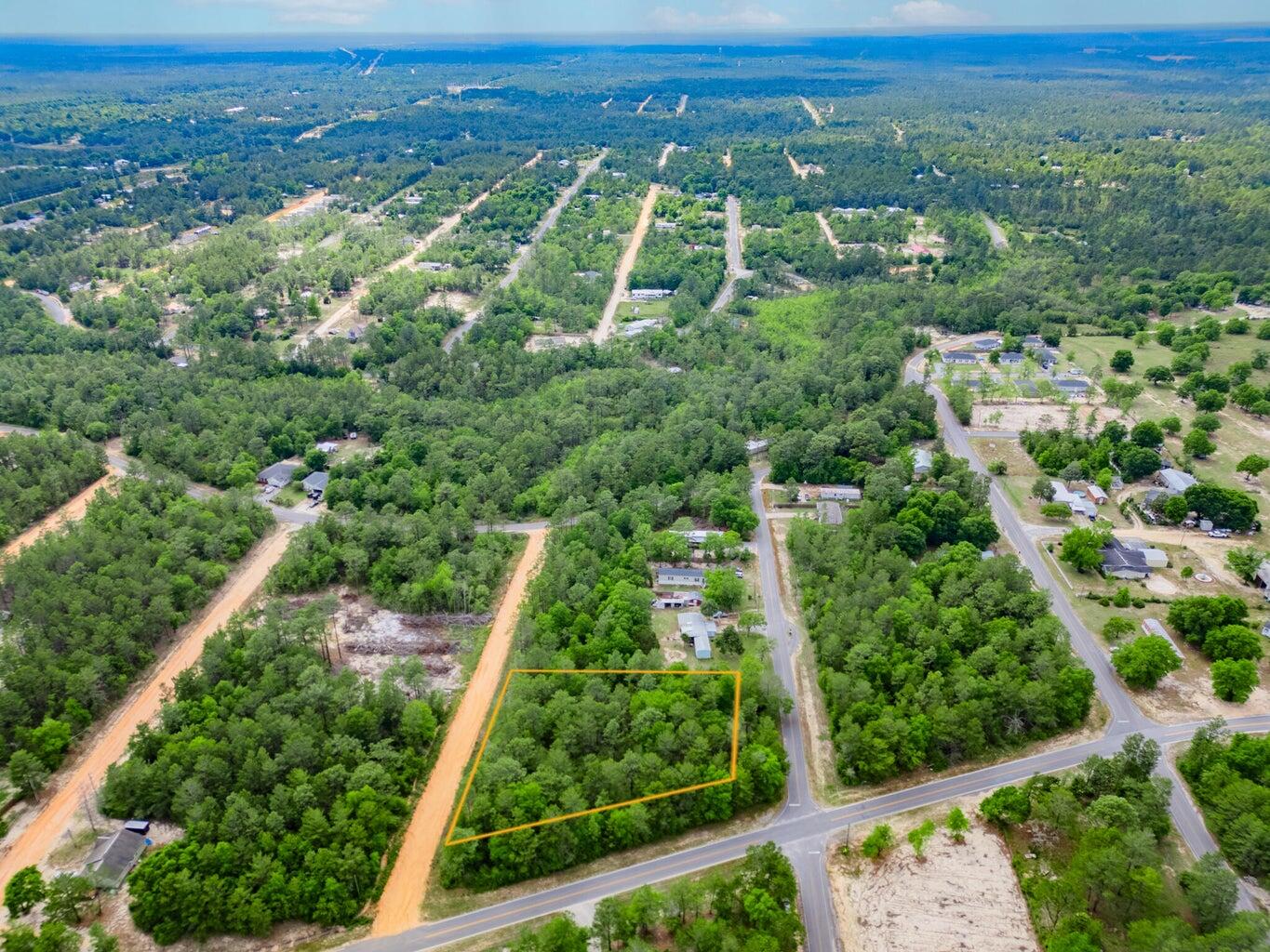 6-11 12 Walden Road DeFuniak Springs, FL 32433 - Photo 2 of 7 an aerial view of residential houses with outdoor space and trees