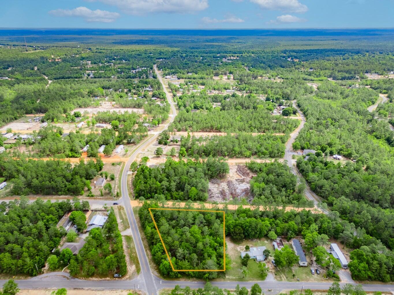 6-11 12 Walden Road DeFuniak Springs, FL 32433 - Photo 3 of 7 an aerial view of residential houses with outdoor space and trees