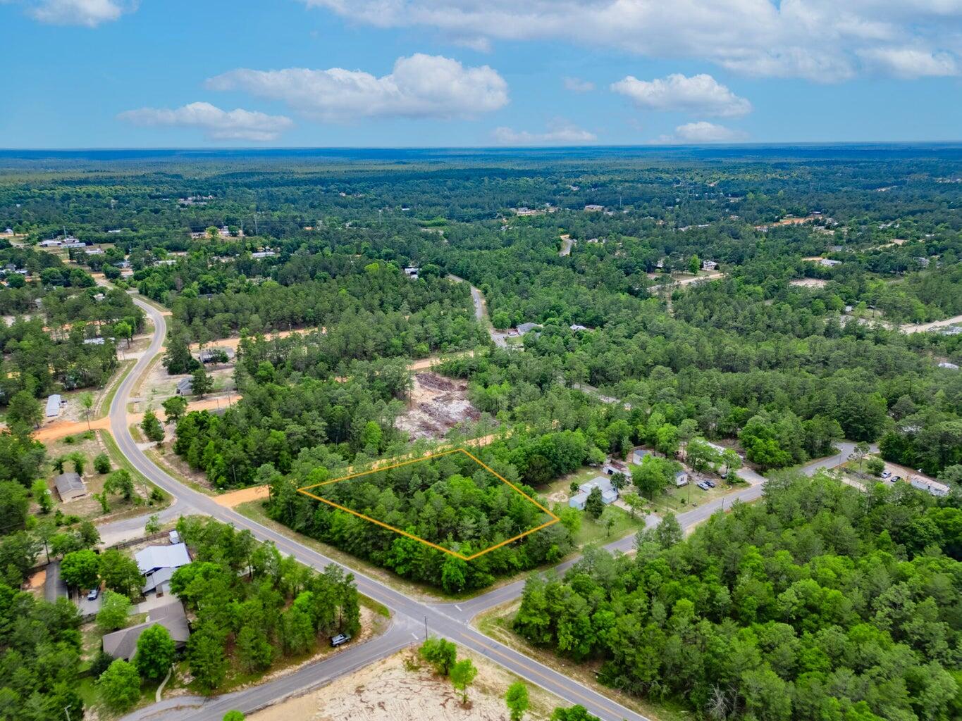 6-11 12 Walden Road DeFuniak Springs, FL 32433 - Photo 4 of 7 an aerial view of residential houses with outdoor space and trees