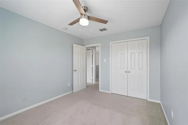 a bathroom with a double vanity sink toilet and shower