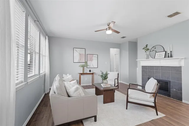 a living room with furniture and a fireplace