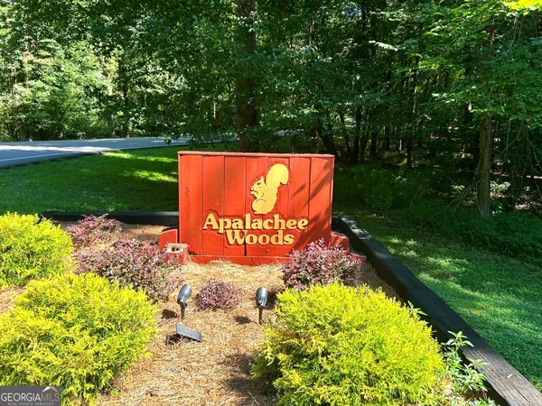 a sign board with garden