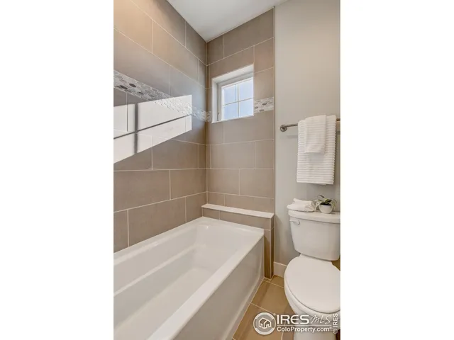 a bathroom with a toilet a sink and bathtub